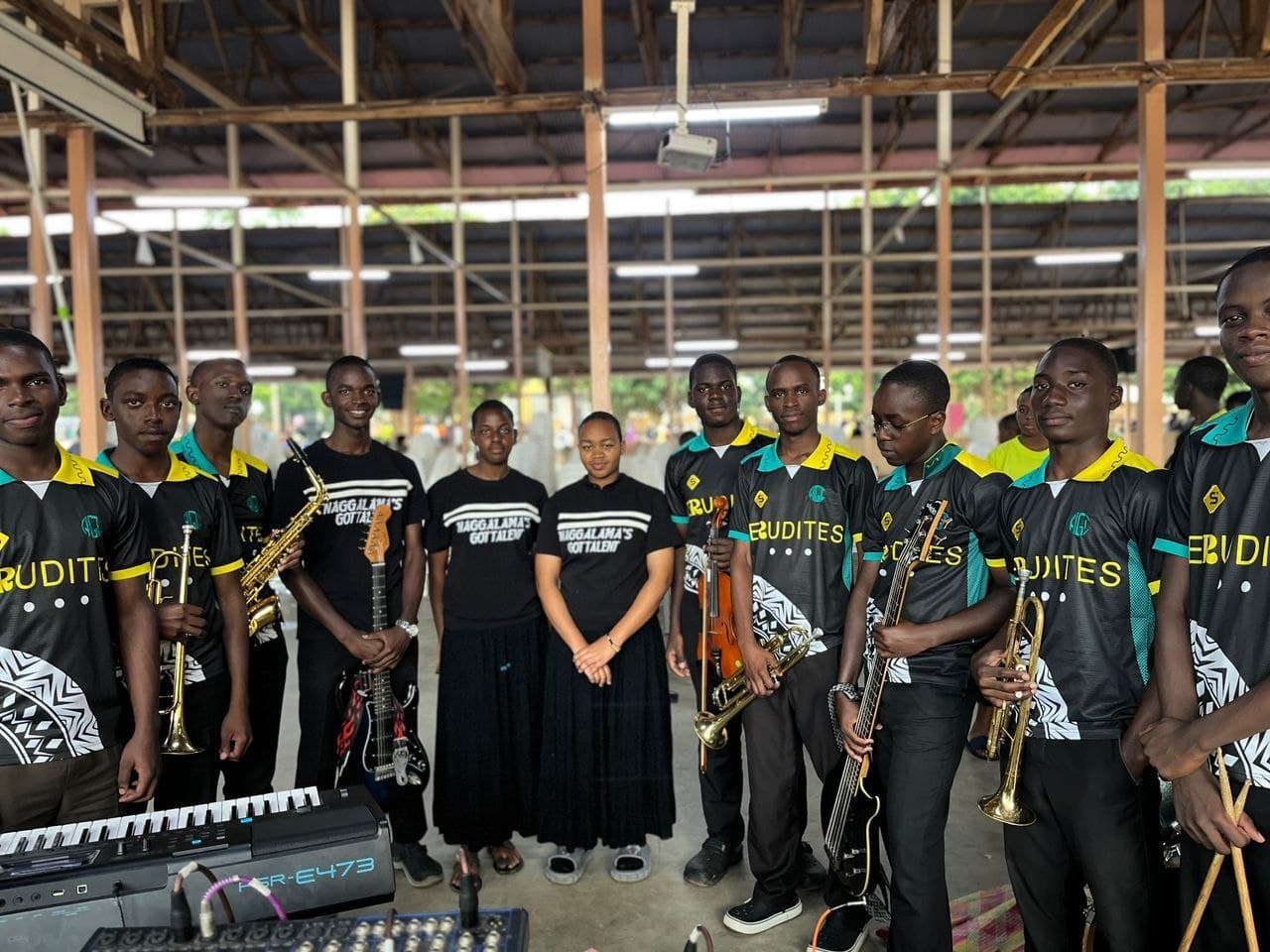 The Area Boys members together in matching jerseys, holding their instruments